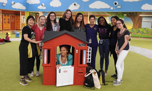 Volunteers in play house