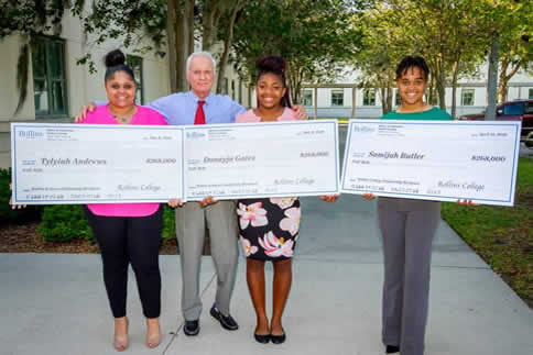 Harris Rosen presenting scholarship checks to kids